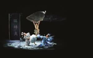 Graceful Chinese traditional dance performance with elaborate costumes and expressive movements, showcasing cultural artistry and heritage.