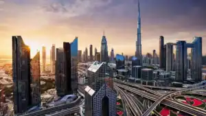 Dubai skyline with Burj Khalifa at sunset, featuring modern skyscrapers and city infrastructure.