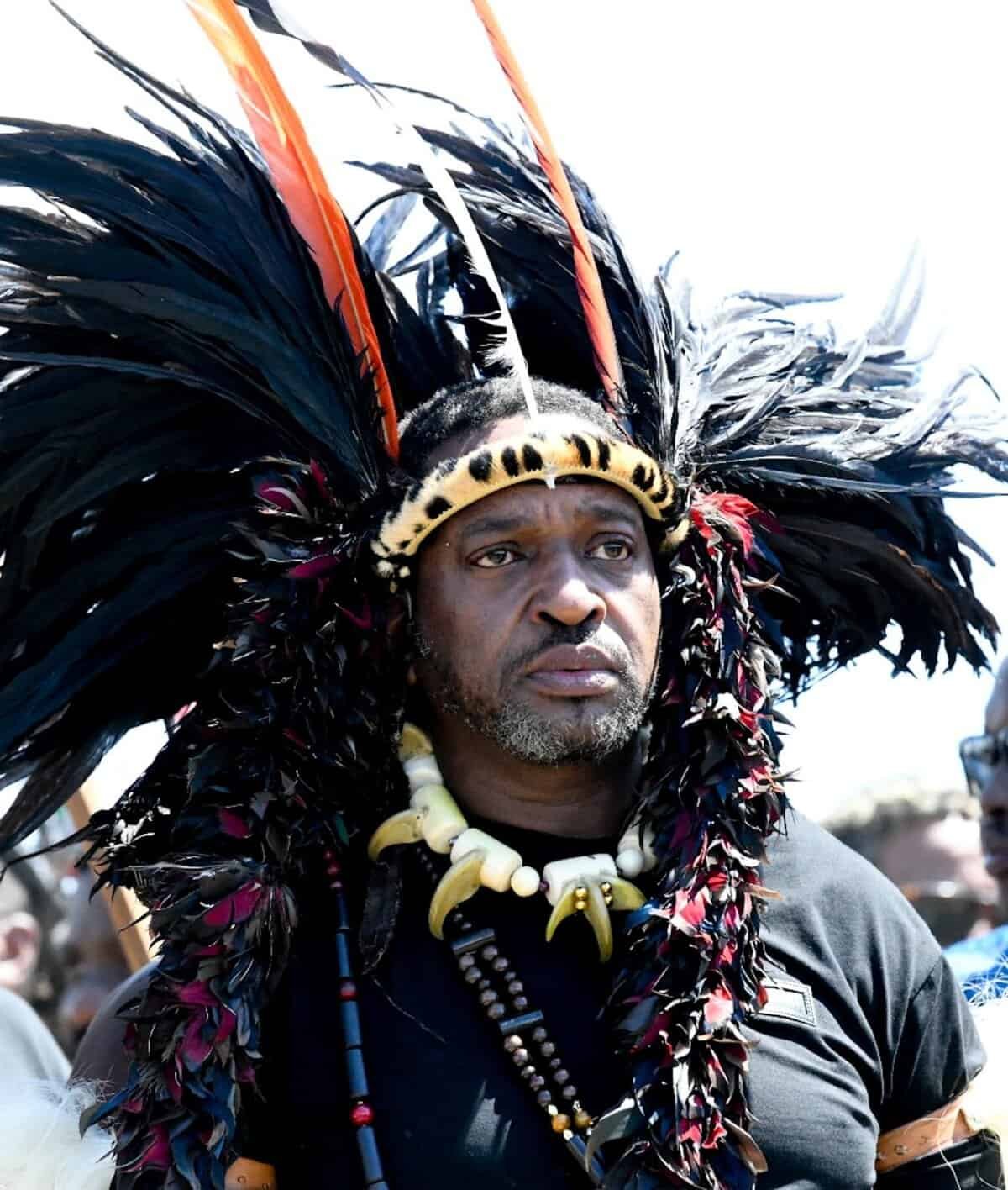 Zulu King Misuzulu ka Zwelithini wearing traditional African headdress with feathers and beads.
