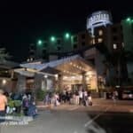 Premier Hotel Tambo Johannesburg at night with guests arriving and parking.