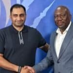 Durban City CEO Younus Kadodia and Scottland FC director Tonderai Sakupwanya shaking hands at a formal event for economic growth.
