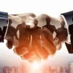 BRICS Youth ESG Dialogue shaking hands symbolizing partnership and collaboration.