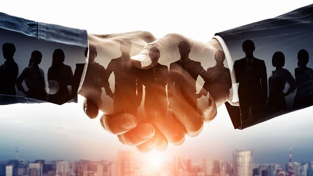 BRICS Youth ESG Dialogue shaking hands symbolizing partnership and collaboration.