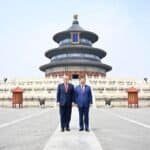 Chinese President Xi Jinping and U.S. President Donald Trump have a photo taken in front of the Hall of Prayer for Good Harvests