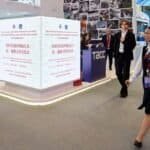 People walk past screens displaying information of the launch ceremony of the Russian edition of the first volume of "China's Governance Under Xi Jinping's Leadership" at the 29th St. Petersburg International Economic Forum in St. Petersburg, Russia, June 3, 2026.