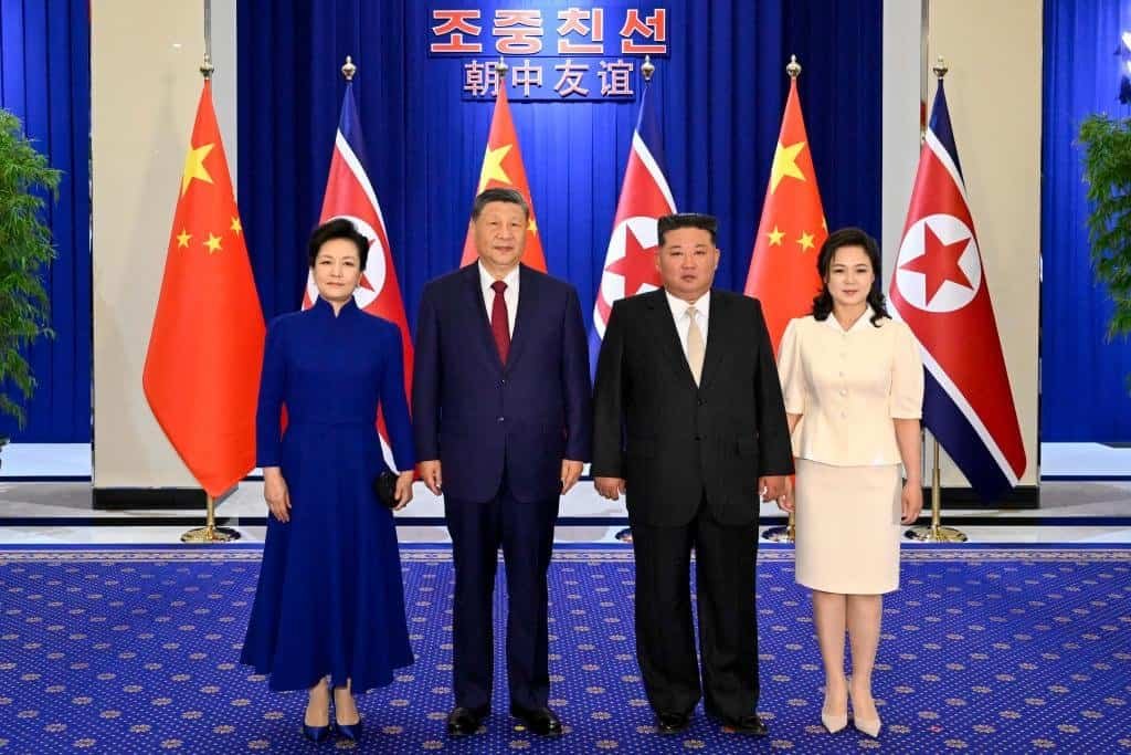 Xi Jinping, general secretary of the Communist Party of China Central Committee and Chinese president, and his wife Peng Liyuan pose for a photo with Kim Jong Un, general secretary of the Workers' Party of Korea and president of the State Affairs of the Democratic People's Republic of Korea (DPRK), and Kim's wife Ri Sol Ju, in Pyongyang, the DPRK, June 8, 2026.