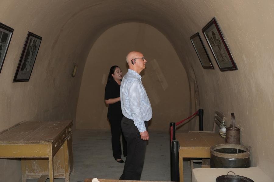 British Ambassador to China Peter Wilson (front) visits a former revolutionary site at Yangjialing in Yan'an, northwest China's Shaanxi Province, June 17, 2026. (Xinhua/Shao Rui)