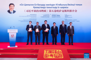 The Chinese side presents Kazakh guests with copies of the Kazakh edition of the fourth volume and the Russian edition of the fifth volume of "Xi Jinping: The Governance of China" at an event promoting the fifth volume of the book in Astana, Kazakhstan, July 15, 2026. The event was held here on Wednesday. (Xinhua/Li Renzi)