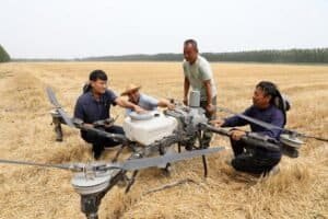 Han Xuerun (1st L) instructs villagers to use a plant protection drone in Hubin Town of Boxing County, Binzhou, east China's Shandong Province, June 15, 2026. (Photo by Chen Bin/Xinhua)