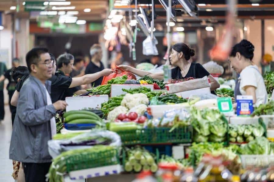 Consumers shop at a market in Huzhou, east China's Zhejiang Province, July 9, 2026. (Photo by Yi Fan/Xinhua)