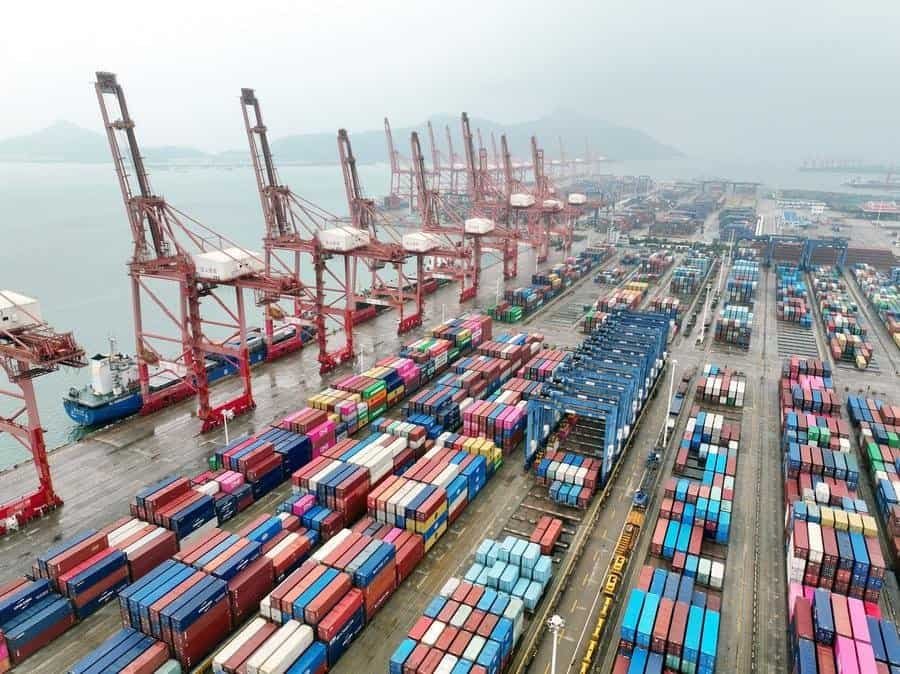 An aerial drone photo taken on July 14, 2026 shows cargo ships loading and unloading containers at a container terminal of Lianyungang Port, east China's Jiangsu Province. (Photo by Wang Chun/Xinhua)