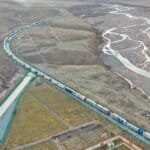 This aerial photo taken on Nov. 7, 2023 shows trucks entering the Irkeshtam port in northwest China's Xinjiang Uygur Autonomous Region. (Xinhua/Ding Lei)