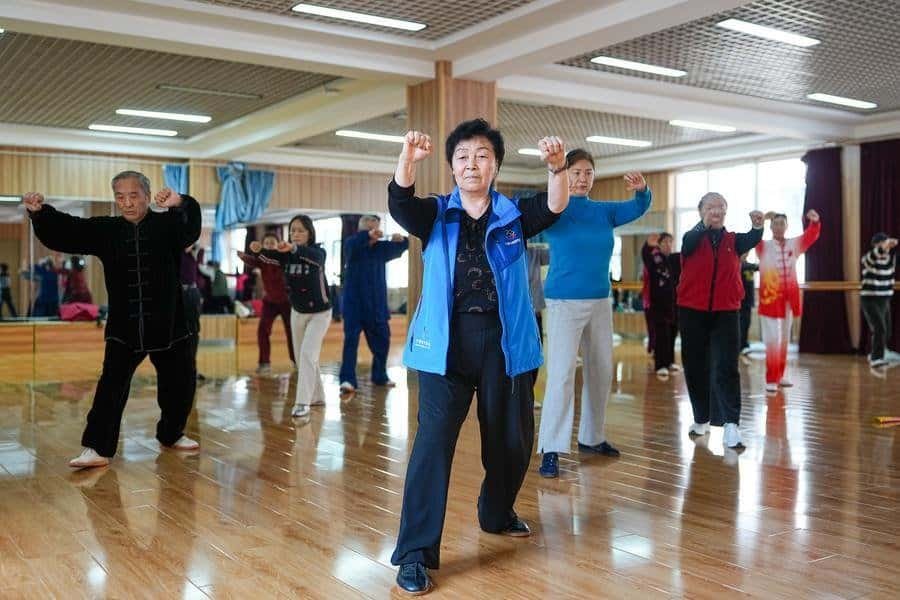Enthusiasts practice Taiji under the guidance of a social sports instructor at a community venue in Jinan, east China's Shandong Province, March 19, 2026. (Xinhua/Zhu Zheng)
