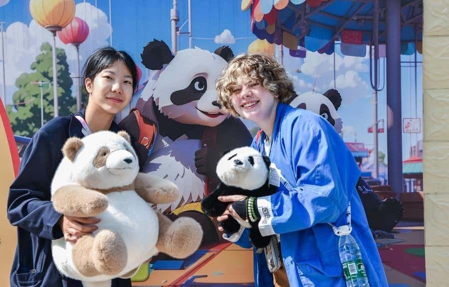 Chinese and American students pose for a photo at Shijiazhuang Zoo in Shijiazhuang, north China's Hebei Province, April 21, 2024. (Photo by Liu Zunshuan/Xinhua)