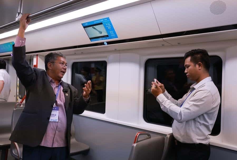 A guest films his passenger experience on Guangzhou Metro Line 18 in Guangzhou, south China's Guangdong Province, Sept. 3, 2026. (Xinhua/Gao Jing)