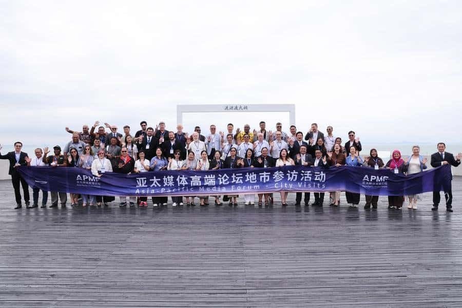 Guests pose for a group photo at the Hong Kong-Zhuhai-Macao Bridge Blue Dolphin Island in Zhuhai, south China's Guangdong Province, Sept. 3, 2026. (Xinhua/Liang Xu)