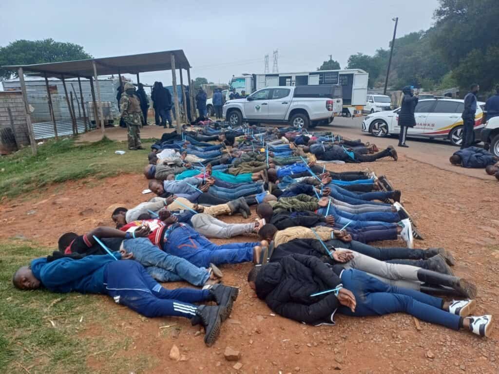 Police and soldiers have arrested 121 suspected illegal miners and recovered five firearms during a major Operation Prosper/Karabo crackdown in Mphahla village, within the Fochville policing precinct on the West Rand. Photo: Supplied