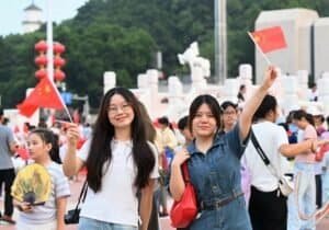 People attend a flag-raising ceremony marking the 77th anniversary of the founding of the People's Republic of China at Wuyi Square in Fuzhou, southeast China's Fujian Province, Oct. 1, 2026. People celebrated the 77th anniversary of the founding of the People's Republic of China in various ways on Thursday. (Photo by Lin Shanchuan/Xinhua)