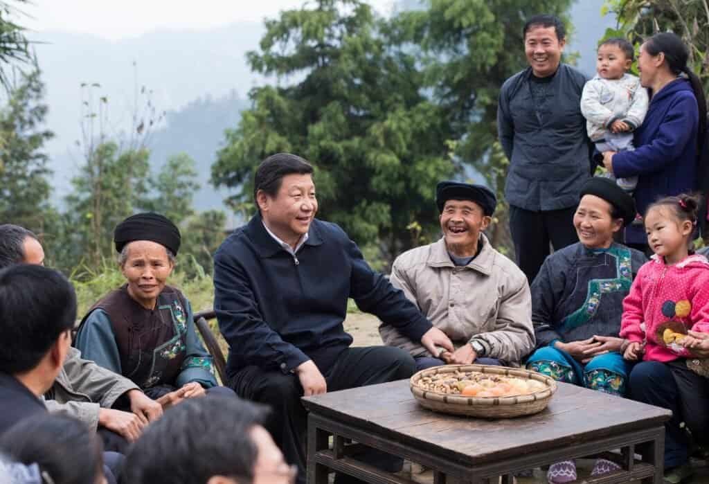 Xi Jinping talks with local villagers and cadres at Shibadong Village in Paibi Township of Huayuan County in the Tujia-Miao Autonomous Prefecture of Xiangxi, central China's Hunan Province, Nov. 3, 2013. (Xinhua/Wang Ye)